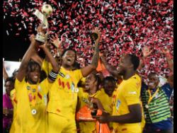 Members of Harbour View FC celebrate after being presented with the Jamaica Premier League (JPL) trophy at Sabina Park in July. They defeated Dunbeholden in the final.
