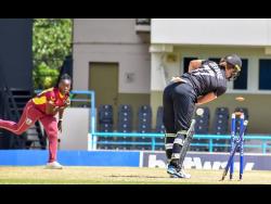 West Indies Women’s Aaliyah Alleyne (left) disrupts the stumps of New Zealand captain Sophie Devine during the third and final one-day international at North Sound, Antigua, yesterday. Devine made seven runs from 18 balls with her wicket being the only one for Alleyne. West Indies won the match by four wickets but lost the series 2-1.