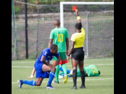 Portmore United’s Seigle Knight (left) receives a red card from referee Odette Hamilton, during their Jamaica Premier League football match against Humble Lion at the Captain Horace Burrell Centre of Excellence in last season’s Jamaica Premier League.