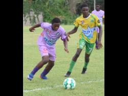 Irwin High’s Leo Campbell (left) and  Green Pond High’s Matthew Ellis battle for the ball during an ISSA/Digicel daCosta Cup match on Tuesday, September 20. Irwin won 2-0.