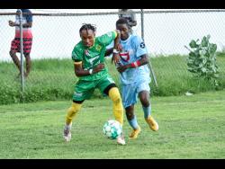 Brandon Solomon of St Jago (left) steals the ball from Nickyle Ellis of St Catherine during their ISSA/Digicel Manning Cup match at Spanish Town Prison Oval on September 20. St Catherine won that match 1-0, which St Jago avenged last week Tuesday with a 2-1 victory.