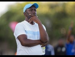 Vere United’s coach Linval Dixon ponders his next move during their Jamaica Premier League clash with Molynes United FC on Sunday at the Anthony Spaulding Sports Complex. Molynes won the match 1-0.