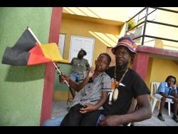 Ralston Bogle and his son Twayne taking in the World Cup at Reggae Fountain Restaurant. 