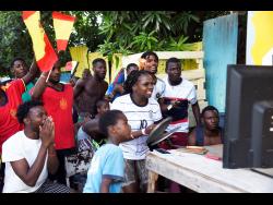 All eyes were glued to the TV on Second Street in Trench Town on Sunday as the Germany-Spain match was the featured game of the day.