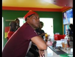 Germany supporter Desmond Faucet looks on as his team battles Costa Rica. He watched the match at the Reggae Fountain Sports Bar and Restaurant in St Andrew. While admitting his team’s failures, he also blamed Spain for not getting a draw against Japan which would have sent the Germans through.