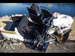 An overhead view of the Toyota Succeed that had its roof ripped off in Sunday’s deadly crash.