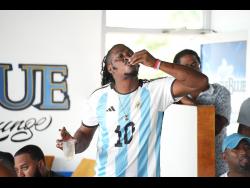 Damion Wint gives a chef’s kiss to the the Argentina football team’s performance in the World Cup finals against France yesterday.