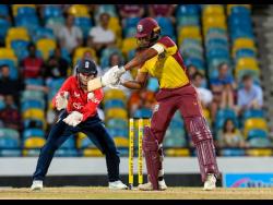  West Indies captain Hayley Matthews (right) on the go while being watch by England Women’s wicketkeeper Amy Jones, in the fourth T20 International at the Kensington Oval in Barbados yesterday.