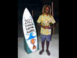 National Surfing champion Icah Wilmot poses with his trophies following the presentation ceremony at the Jamaica Surfing Association awards held recently at Wicky Wacky in Bull Bay, St Andrew.