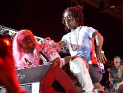 O’Neil ‘Short Man’ Elliot shows dancehall artiste Pamputtae that he is no slouch, as they perform at Sting, held on December 26 at Grizzly’s Plantation Cove, Priory St Ann.