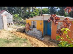 Three men were building this perimeter wall in Bethel Town, Westmoreland, on Wednesday, when they were ambushed by a lone gunman. Two of them succumbed to their injuries while another is being treated in hospital.