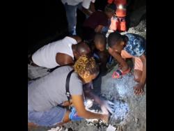 Residents of Comfort Castle in Hanover use flashlights to continue digging for what they believe to be traces of gold.