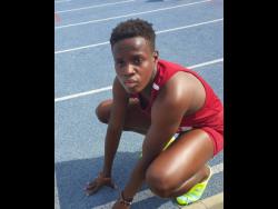 Holmwood captain Rickiann Russell recovers after her personal best 52.88 seconds in the Class I girls’ 400 metres at the Queen’s/Grace Jackson Invitational on Saturday at the National Stadium.