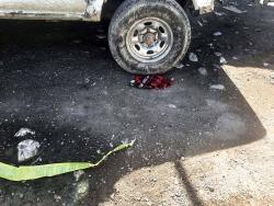 Underpants which relatives said belonged to Richard Davidson lay on the ground. Residents are adamant that Davidson and his friend Javon Davy were killed in cold blood by police.