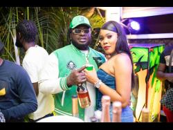 Recording artiste Jah Vinci clutches his better half, Stacey-Ann McGhie, at his birthday and album listening party held at the Sea Deck Restaurant and Lounge, Orchid Village Plaza, Kingston, last Thursday.