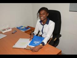 Recipient of the most outstanding performance in humanities award in the 2022 sitting of the Caribbean Examinations Council’s Caribbean Advanced Proficiency Examination, Dora Watt, at work at the Montego Bay Restorative Justice Centre in St James. 