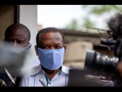 FILE – Yves Jean-Bart, president of the Haitian Football Federation, wearing a protective face mask, arrives for a court hearing regarding allegations that he abused female athletes at the country’s national training centre, in Croix-des-Bouquets, Haiti, May 21, 2020. Haiti’s former football federation president, whose lifetime ban from sport over sexual abuse allegations was overturned in February, announced yesterday that he is reclaiming his position.