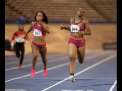 Tina Clayton (right) of MVP Track Club wins Section A of the women’s 200 metres at Velocity Fest 12 at the National Stadium in St Andrew on Saturday. Clayton won in 23.69 seconds. Briana Williams (left) of Titans Track Club finished third in 24.03.