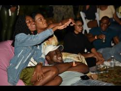 Credit: Kenyon Hemans Patrons enjoying one of the productions at Shot List film festival at Hope Gardens on Sunday.