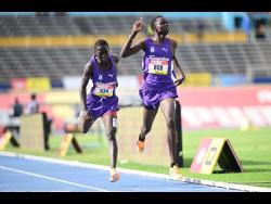Kingston College take the gold and silver in the class 2 boys 1500m with Brian Kiprop (right) winning gold ahead of teammate Nahashon Ruto. 