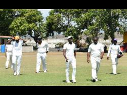 Members of Greater Portmore enter the Prison Oval field before dismissing Correctional Services for 113 in their Jamaica Energy Partners (JEP) St Catherine cricket league over the weekend.