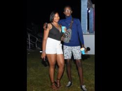Tashia Palmer and Jordan Sawyers enjoy the night out at Moonlight Soirée at Montego Bay Sports Complex in Catherine Hall, St James, on Saturday night..