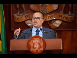 Minister without Portfolio in the Ministry of Economic Growth and Job Creation, Senator Matthew Samuda, addresses a post-Cabinet press briefing at Jamaica House on Wednesday.