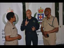 Commissioner of Police, Major General Antony Anderson (centre), makes a point to Head of Police Area One, Assistant Commissioner of Police, Clifford Chambers (right), and Commanding Officer for Hanover, Superintendent Sharon Beeput, during a stakeholder engagement at the Round Hill Hotel and Villas in Hanover on Tuesday.