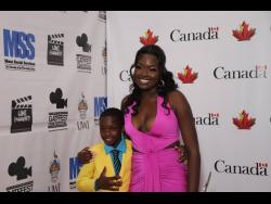 Shaquana Wilson (right) and Djamari Roberts, who play mother and son in the Canadian-Jamaican film ‘When Morning Comes’ are all smiles on the red carpet at the movie’s GATFFEST premiere last Wednesday at the Palace Cineplex, Sovereign Centre, St Andrew.
