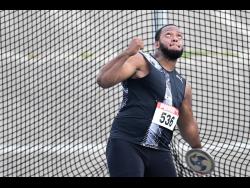 Reckless Control’s Traves Smikle is about to throw the men’s discus to 66.12 metres for victory at the National Senior and Junior Championships at the National Stadium on Saturday.