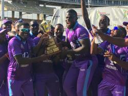Surrey Kings’ captain Jeavor Royal (centre) celebrates with teammates after claiming the Dream XI Jamaica T10 trophy following their five-run win over the Surrey Royal in the final at Sabina Park yesterday.