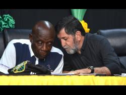 Former Reggae Boyz head coach Rene Simoes speaks with former Jamaica Football Federation (JFF) president Crenston Boxhill during the press launch of the Porus Football Festival on Wednesday at the JFF headquarters.