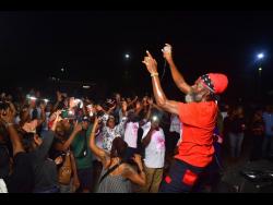 The ‘Fireman’ Capleton gets the crowd in a frenzy at the set-up for his late manager Claudette Kemp, which was held at the Police Officers’ Club, Hope Road, St Andrew on Monday.