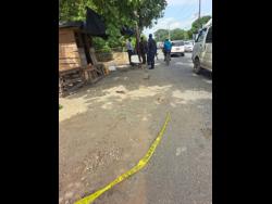 The  scene in Jobs Lane, Spanish Town, St Catherine, at which two men were killed on Wednesday.