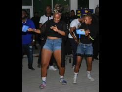 Taliesin and Mibinti Webbe show off their dance moves.