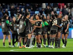 Jamaica players celebrate after their Women’s World Cup Group F football match against France at the Sydney Football Stadium in Sydney, Australia, on Sunday. The game ended in a 0-0 draw.