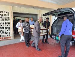 Pallbearers carry the coffin bearing the remains of Delores Elizabeth France from the Norwood Seventh-day Adventist Church in Norwood, St James, on Sunday.