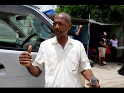 Pastor Michael Hill leads a church service in the town of Seaforth, St Thomas, on Tuesday.