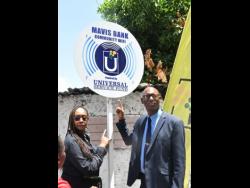 Member of Parliament for St Andrew East Rural, Juliet Holness (left), and Director of Projects, Universal Service Fund, Jaime Robinson, celebrate the launch of community Wi-Fi in Mavis Bank on Monday. 