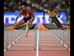 Jamaica’s Danielle Williams (right) battles with Puerto Rico’s Jasmine Camacho-Quinn in the women’s 100 metres hurdles semi-finals.