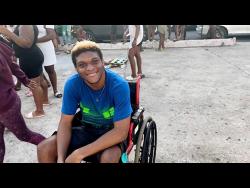 Tivoli Gardens resident Jaleel Coote was ecstatic to meet Chris Brown.