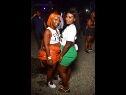 Natasha Daley (left) and Stacy-Ann Williams hang out at Streetz Festival, featuring Masicka, at the National Stadium in St Andrew last Saturday.