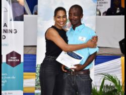Blind farmer Tyrone Traille shares a moment with Member of Parliament for St Ann  South East Lisa Hanna.