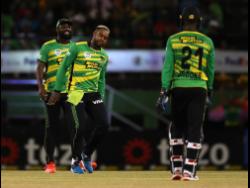 Fabian Allen (centre) of Jamaica Tallawahs celebrates after getting the wicket of Roston Chase of St Lucia Kings during the Republic Bank Caribbean Premier League T20 eliminator match between Saint Lucia Kings and Jamaica Tallawahs at Providence Stadium in Georgetown, Guyana, last night.