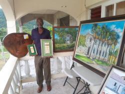 Harper with two silver medals that he won in Jamaica Cultural Development Commission competitions.