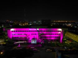 A pink-lit Sagicor building, in observance of breast cancer awareness.
