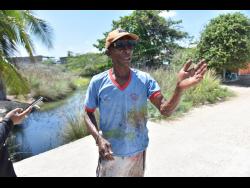 In addition to dengue fears, fisherman Coswell Daley is also worried about crocodiles.