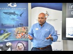 Director of Global Ocean Policy at Georgia Aquarium, Dr Dayne Buddo speaking at the Shark Education Workshop at the AC Hotel, Lady Musgrave Road, St Andrew on Tuesday.
