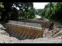 Work on the box culvert bridge in Llandewey, St Thomas, has been progressing at near snail’s pace. 