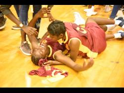 Jessica Chaplain (left) celebrates euphorically with teammate Celina Collins after Holmwood defeated Glenmuir in last season’s final of the ISSA Rural Junior schoolgirls netball competition at the National Indoor Sports Centre in December.